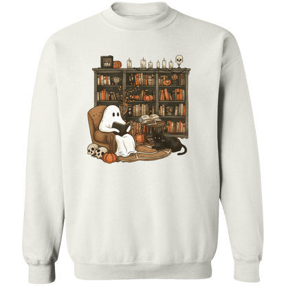  graphic t-shirt with an illustration of a ghost character reading a book, set against the backdrop of a bookshelf with various books and decorative items.